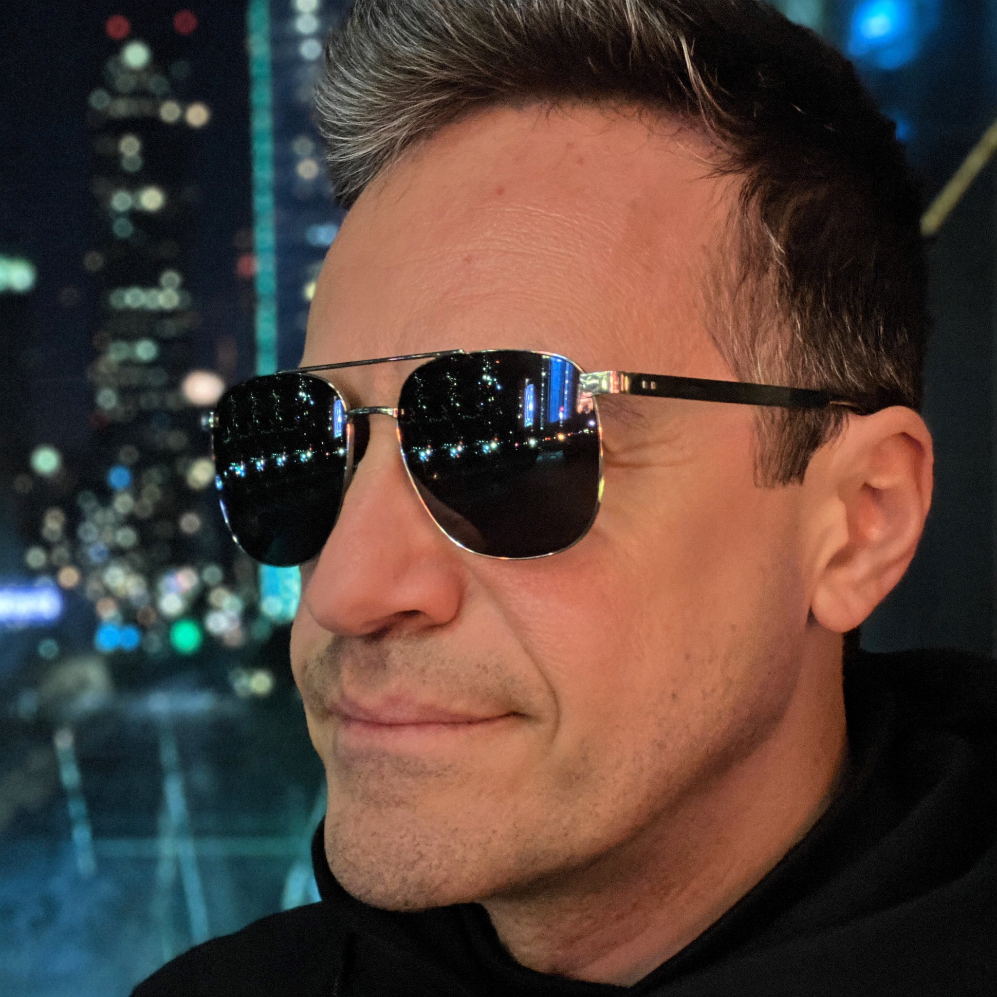 Manhattan cityscape reflected in Roberto Pereira Eisenlohr's sunglasses